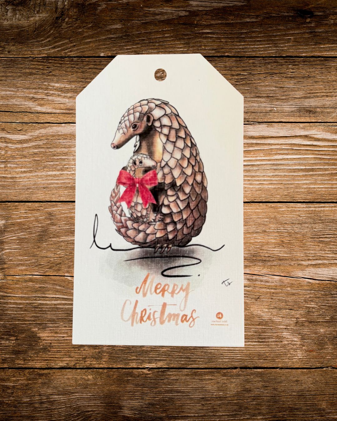 pangolin bow christmas gift tag, a pangolin with a red bow