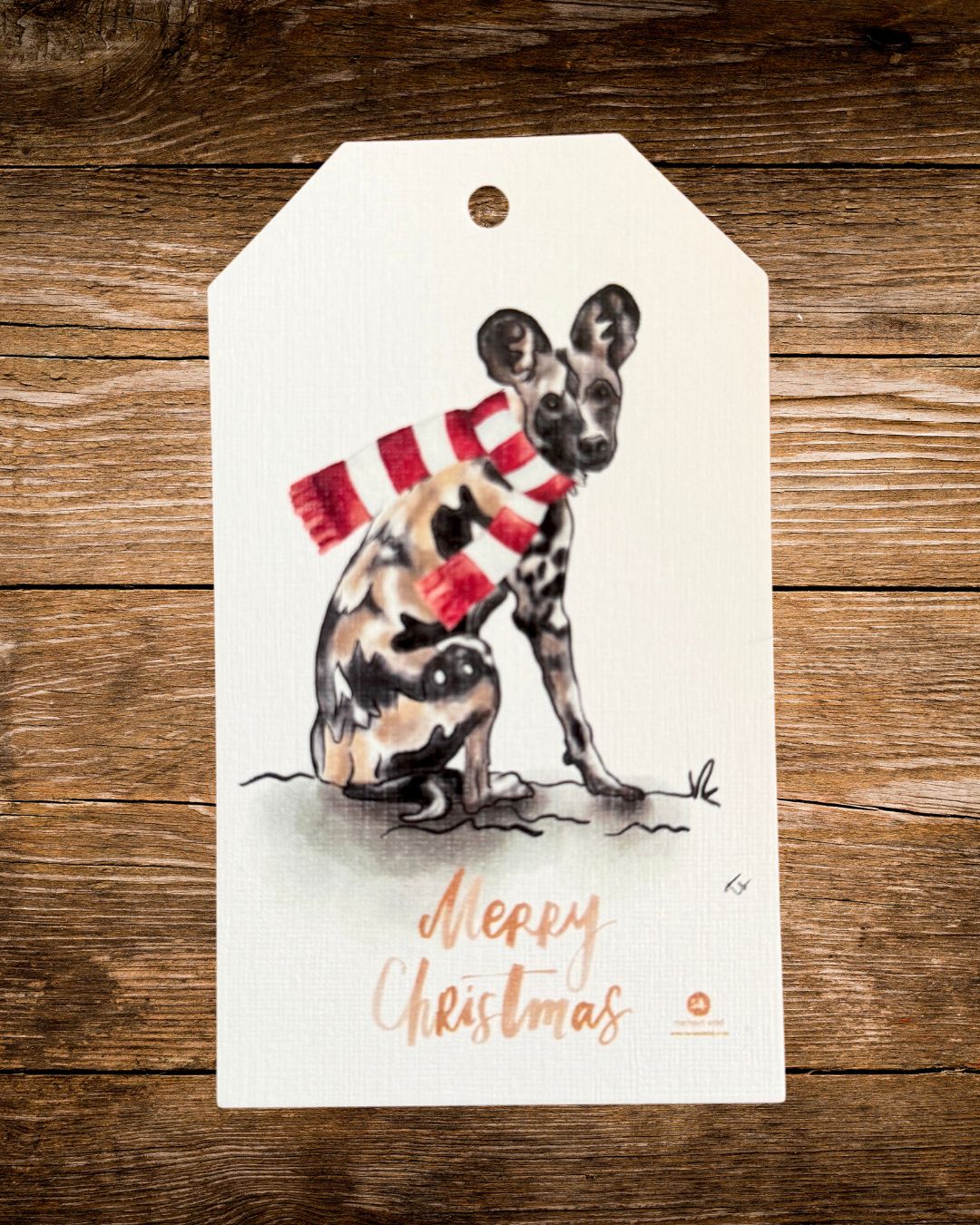 wild dog scarf christmas gift tag, an african wild dog in a knitted scarf