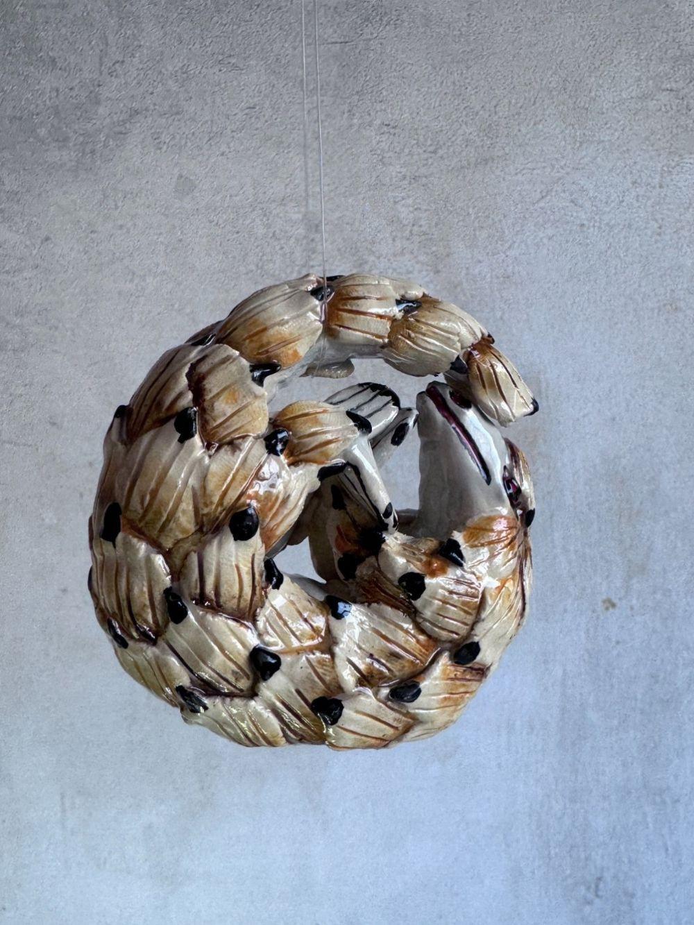 Handmade ceramics Pangolin sculpture by Rachael Wild, featuring detailed artistic craftsmanship in ceramic art.