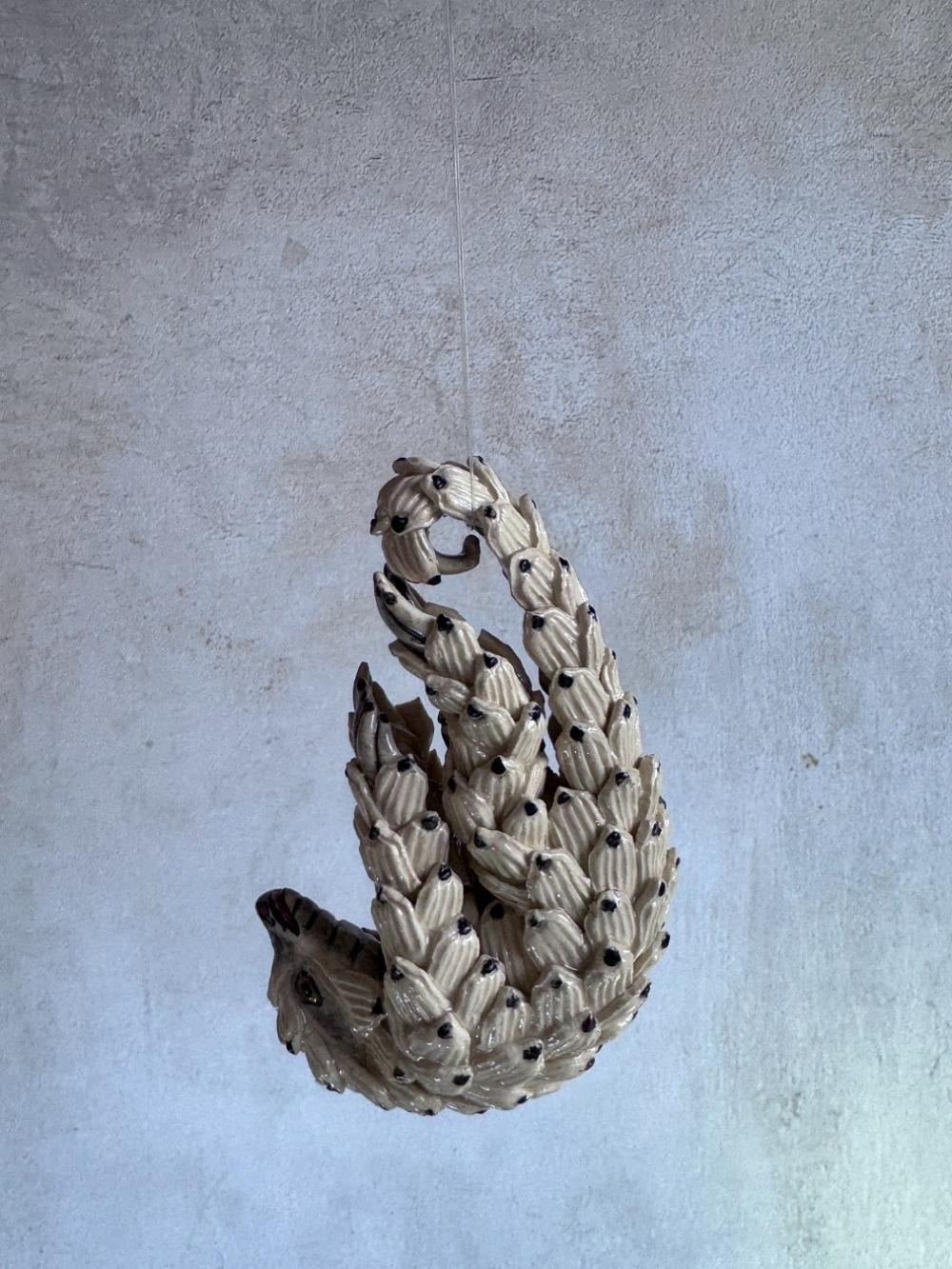 Handmade ceramics Pangolin sculpture by Rachael Wild, featuring detailed artistic craftsmanship in ceramic art.