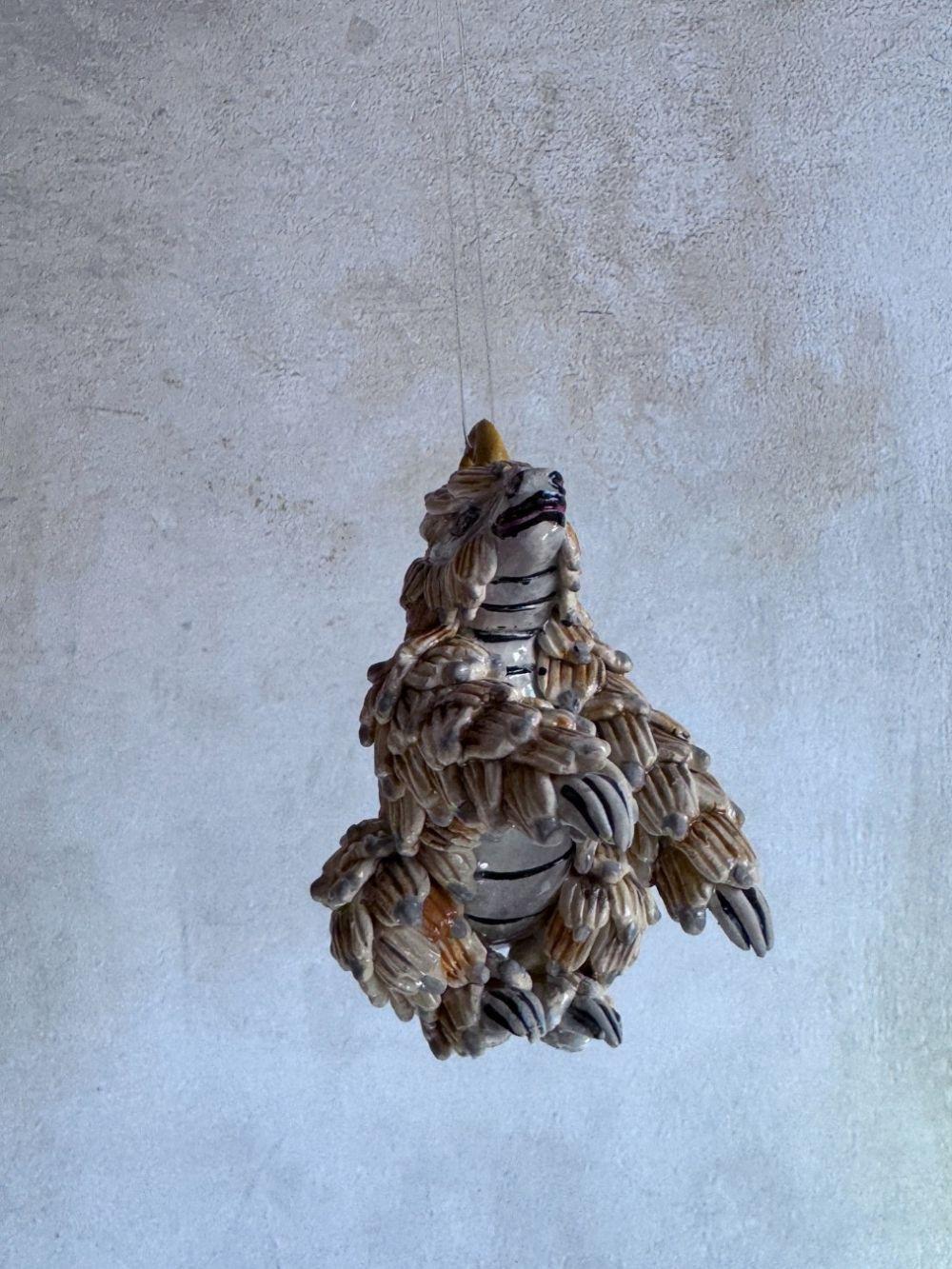 Handmade ceramics Pangolin sculpture by Rachael Wild, featuring detailed artistic craftsmanship in ceramic art.