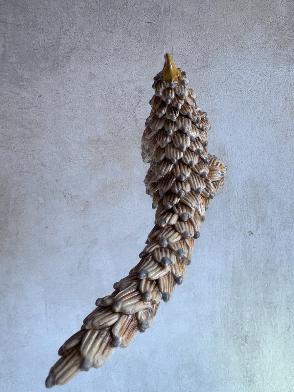 Handmade ceramics Pangolin sculpture by Rachael Wild, featuring detailed artistic craftsmanship in ceramic art.