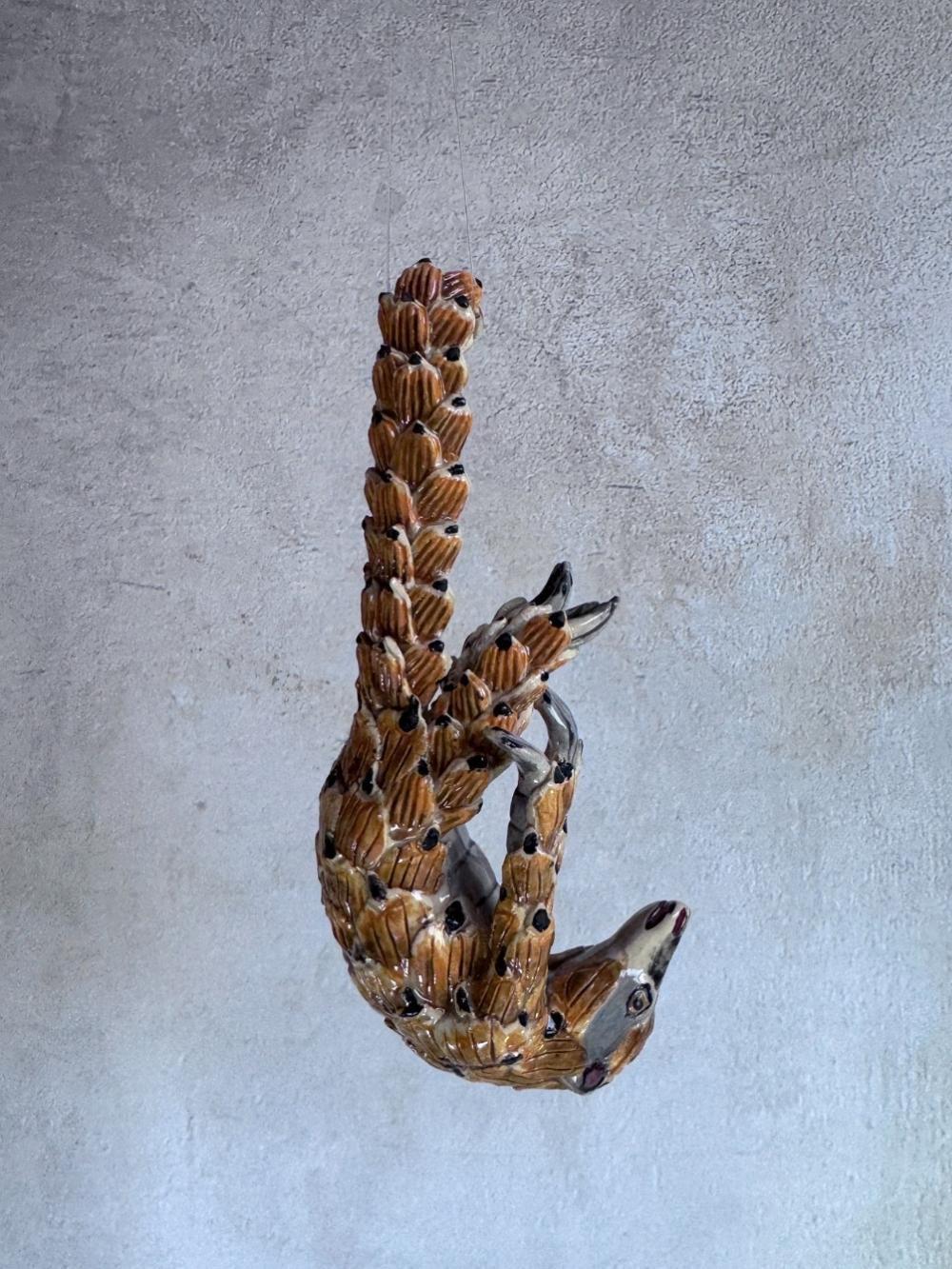 Handmade ceramics Pangolin sculpture by Rachael Wild, featuring detailed artistic craftsmanship in ceramic art.