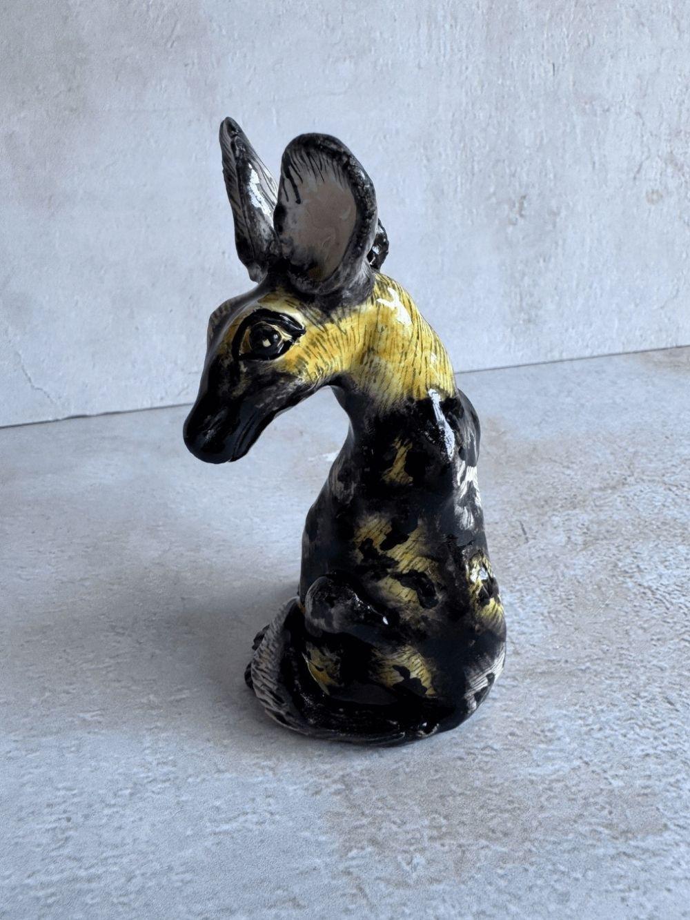 Handmade wild dog sculpture by Rachael Wild, showcasing exquisite craftsmanship and artistic detail.