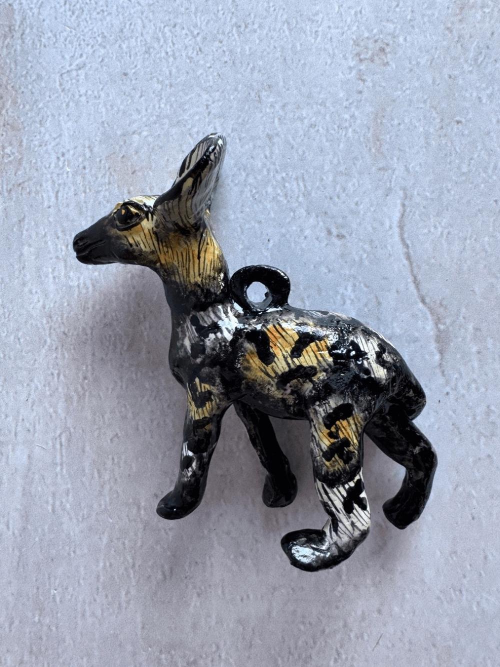 Handmade wild dog sculpture by Rachael Wild, showcasing exquisite craftsmanship and artistic detail.
