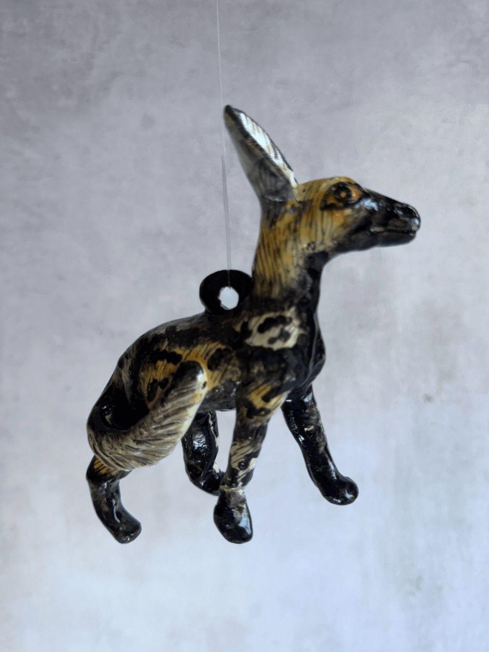 Handmade wild dog sculpture by Rachael Wild, showcasing exquisite craftsmanship and artistic detail.