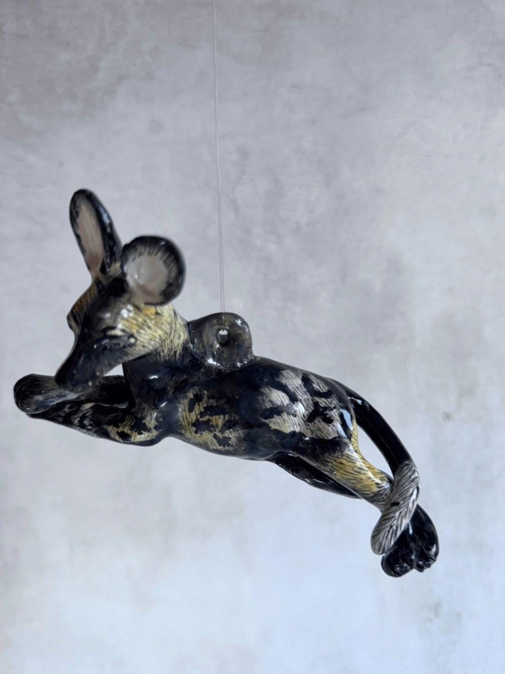 Handmade wild dog sculpture by Rachael Wild, showcasing exquisite craftsmanship and artistic detail.